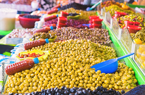 Market stall selling fresh olives.