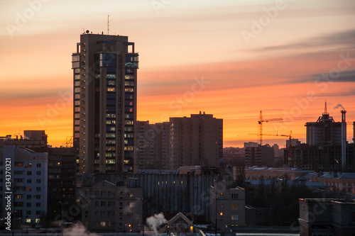 Modern buildings of Voronezh on background of crimson sunset 