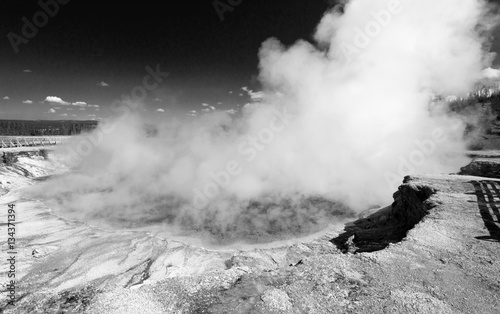 Excelsior Geyser in the Midway Geyser Basin next to the Firehole River in Yellowstone National Park in Wyoming USA - black and white