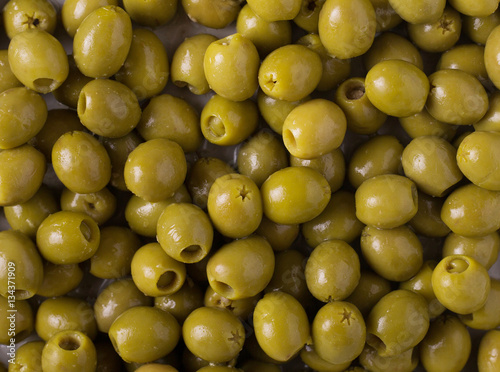 Background of olives. Background with green olives. Olives.  Olive
