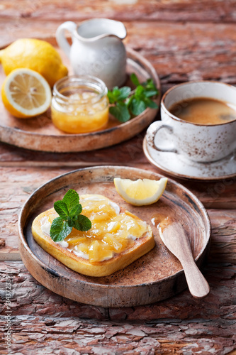 Low-carb gluten free homemade bread toast with butter and lemon jam, selective focus