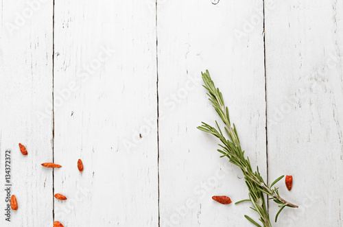 background rosemary, chili pepper on a wooden table