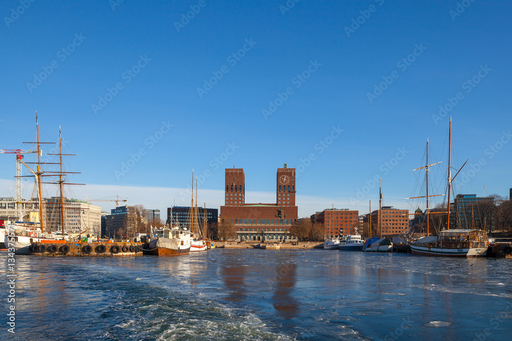 OSLO, NORWAY, 28 FEB 2016: View of City hall, boats and harbour from water