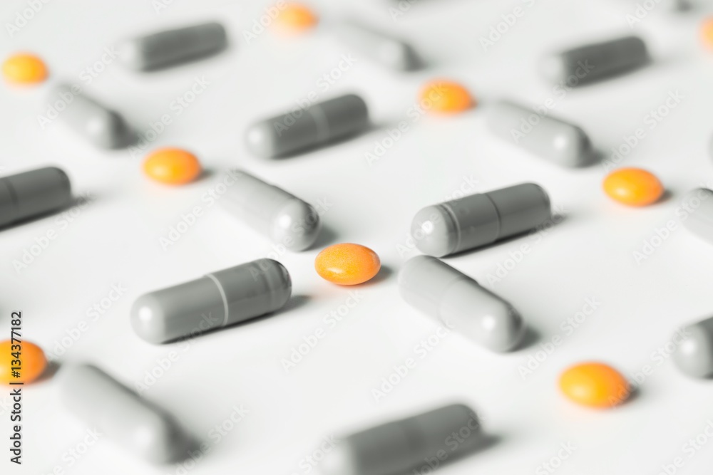medical pills and capsules pattern on white background. flat lay, top view. medical pills and capsules pattern on white background. flat lay, top view.