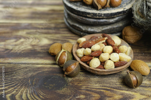 Roasted salted nuts mix, snack from macadamia, walnuts and almonds