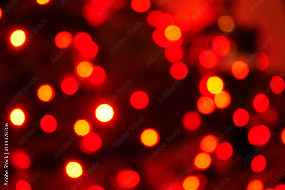 Aggressive red and orange bokeh dots from light, warm abstract background Aggressive red and orange bokeh dots from light, warm abstract background