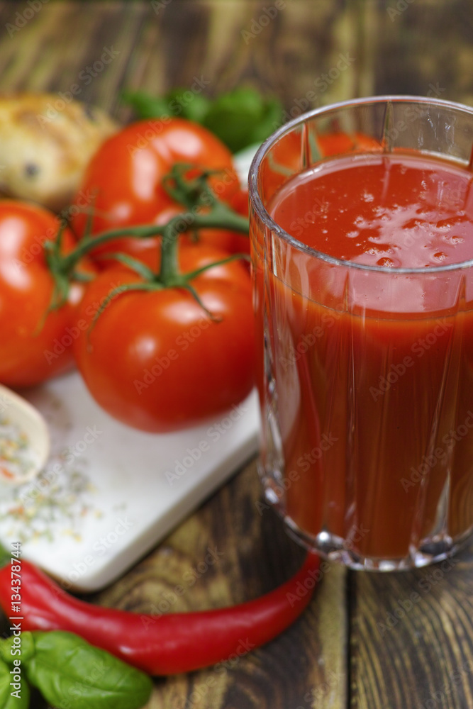 Raw Organic red Tomato Juice with salt, basil and bread Raw Organic red Tomato Juice with salt, basil and bread