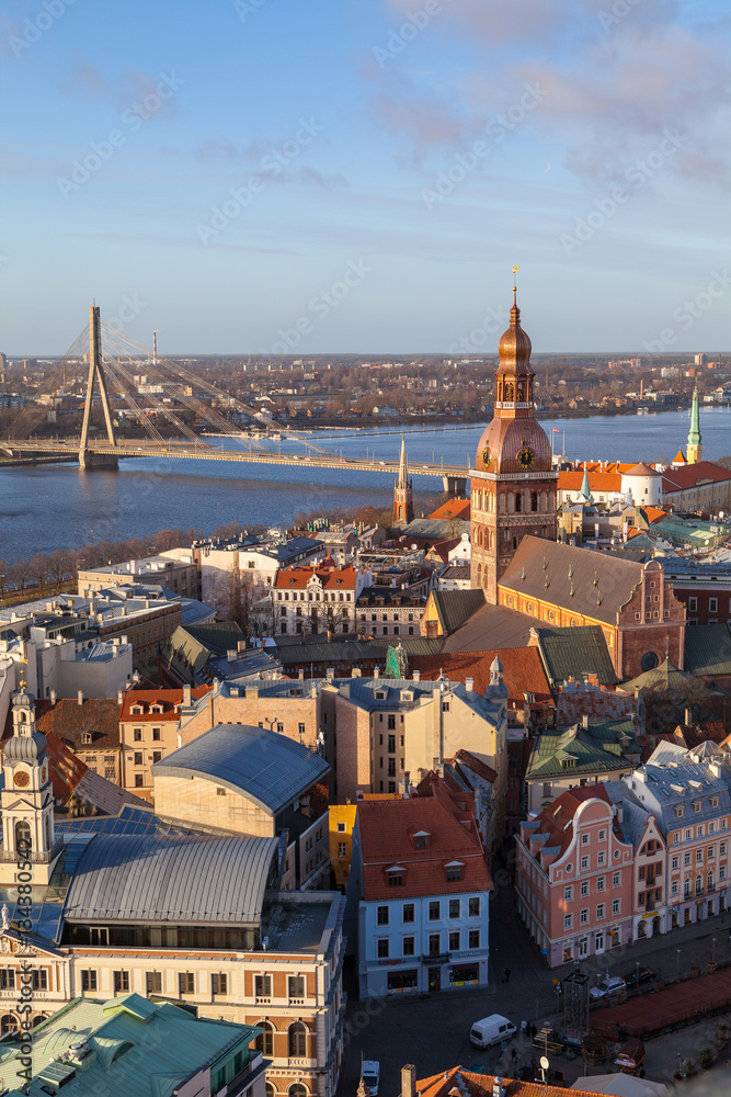 Aerial summer day view of old town and Daugava river from St Peter church, with Riga Cathedral, Latvia. Vertical shot