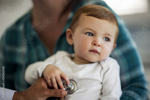 Close-up of baby boy having a medical check-up photo