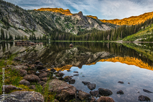 Fototapeta Naklejka Na Ścianę i Meble -  Sunrise reflection on high mountain lake in Montana's Bitterroot Mountains