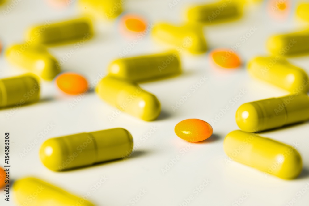 medical pills and capsules pattern on white background. flat lay, top view. medical pills and capsules pattern on white background. flat lay, top view.