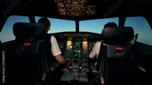 Modern passenger aircraft Airbus A319 A320 A321 during flight in clear sky without clouds. Cabin crew in work