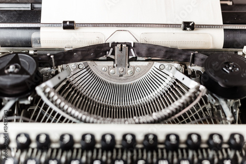 Retro old typewriter with paper sheet