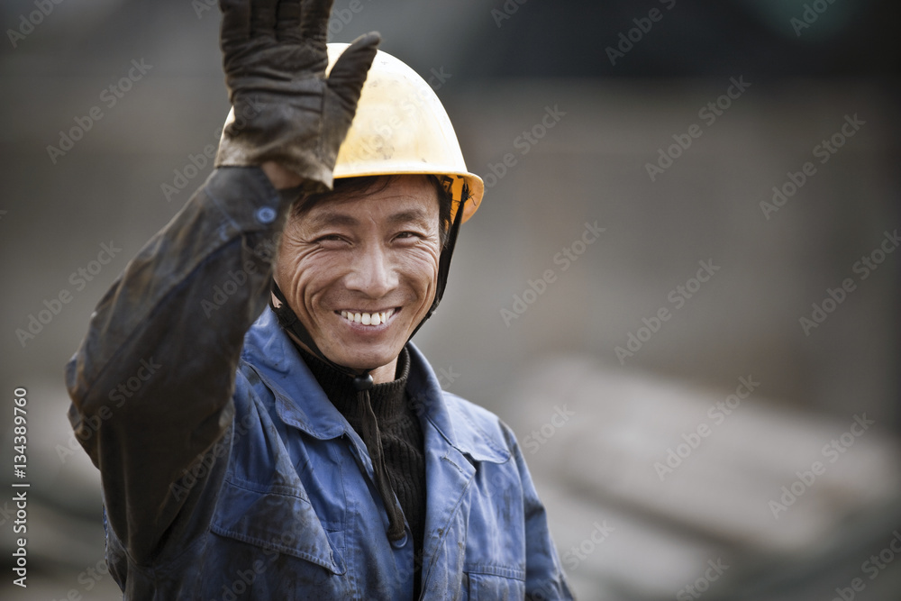 Portrait of smiling construction worker on site