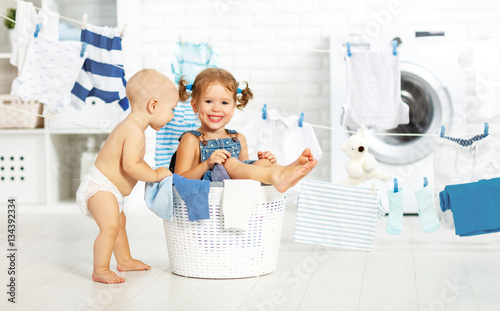 little helpers funny kids happy  in laundry to wash clothes, pla