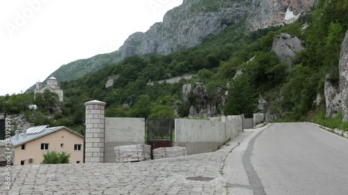 Entrance gate to the lower monastery of Ostrog. View at the upper monastery in Ostrosha Greda. The Serbian Orthodox Church. Montenegro
