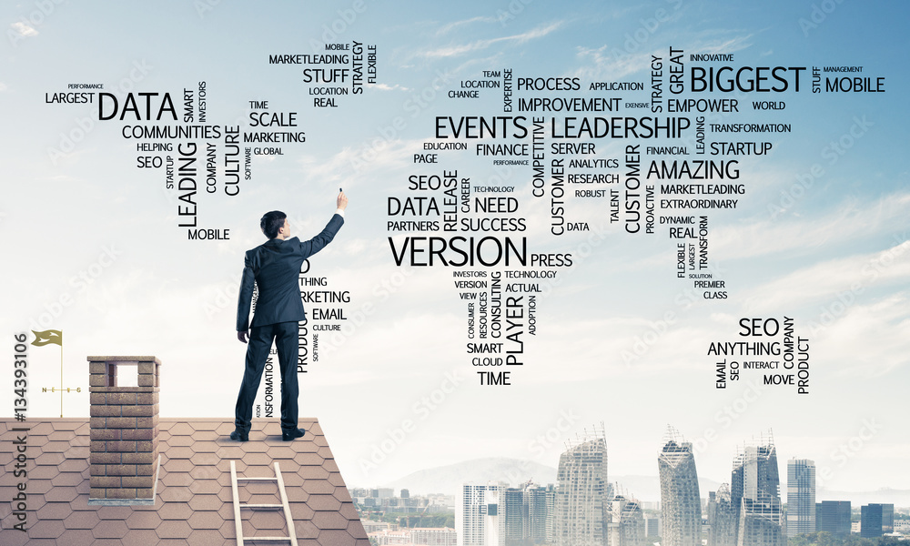 Businessman on brick roof draw world map as concept of globaliza Businessman on brick roof draw world map as concept of globaliza