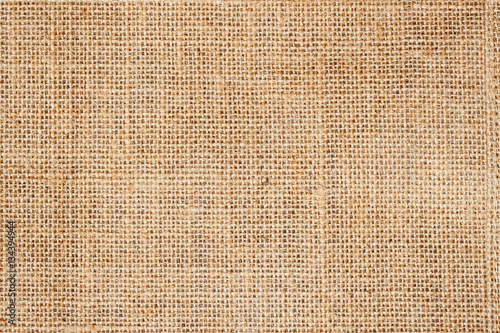 Sackcloth or burlap background with visible texture  copy space for text and other web  print design elements. photo