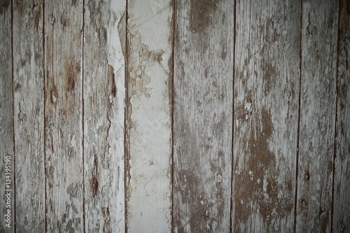 Vintage weathered shabby white painted wood texture as background.