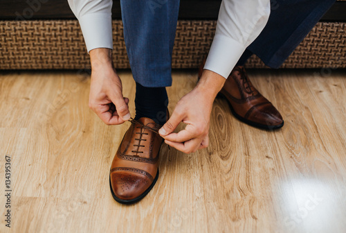 Business man dressing up with classic, elegant shoes.