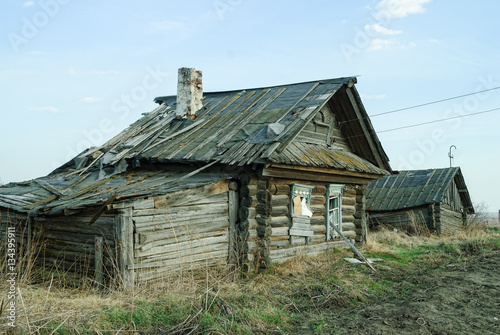 Wooden abandoned old house with the driven-in windows in Preobrazhenskoe. Tyumen region. Russia