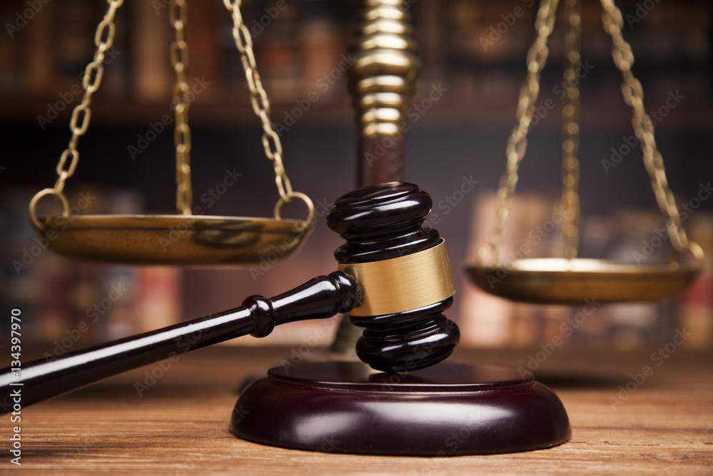 Law books, mallet of the judge, Courtroom background