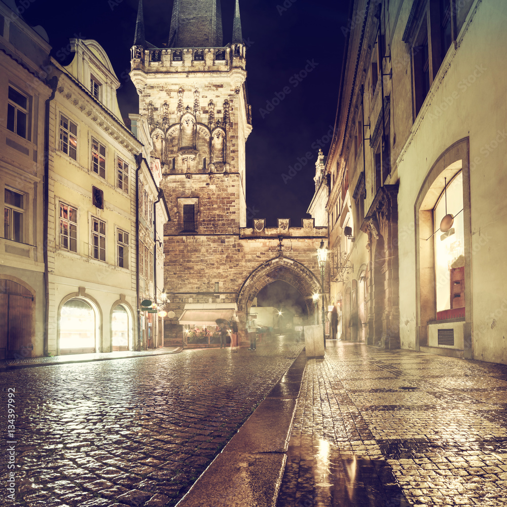 Fototapeta premium Charles Bridge Tower on a rainy night in Prague