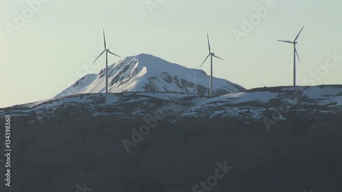 Alaska Snowy mountains with wind turbines