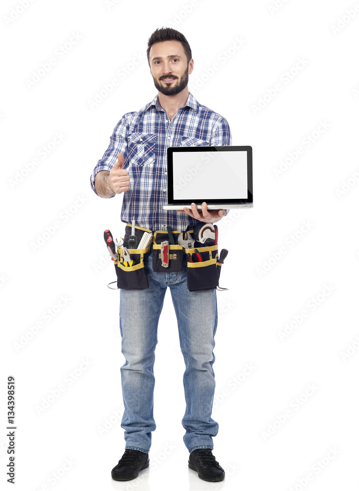 Confident handyman with laptop Confident handyman with laptop