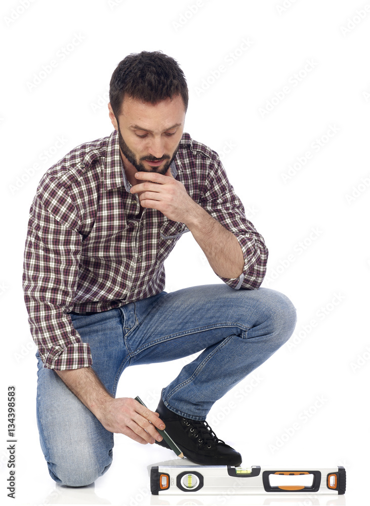 Handyman measuring on floor