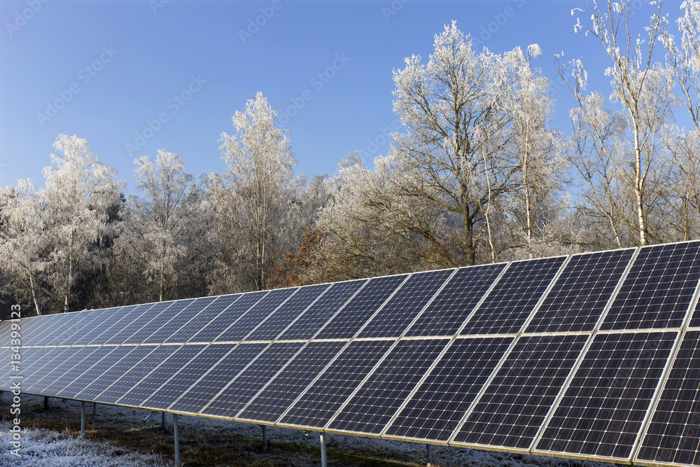 Solar Power Station in the snowy freeze winter Nature