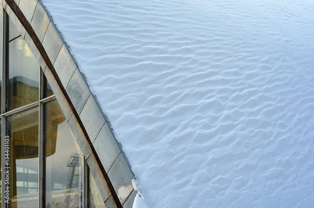Fototapeta premium Fragment of arched roof with snow