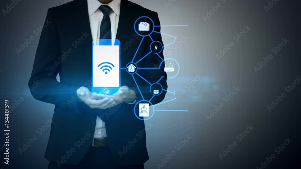 Businessman holding digitally generated icons