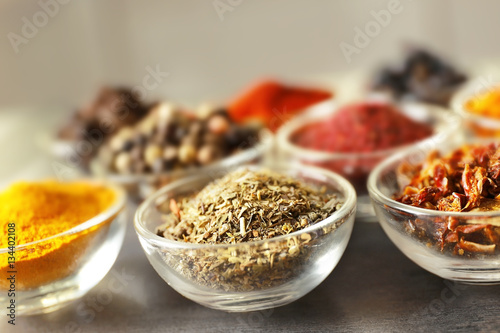 Φωτογραφία Various spices in glass bowls, closeup