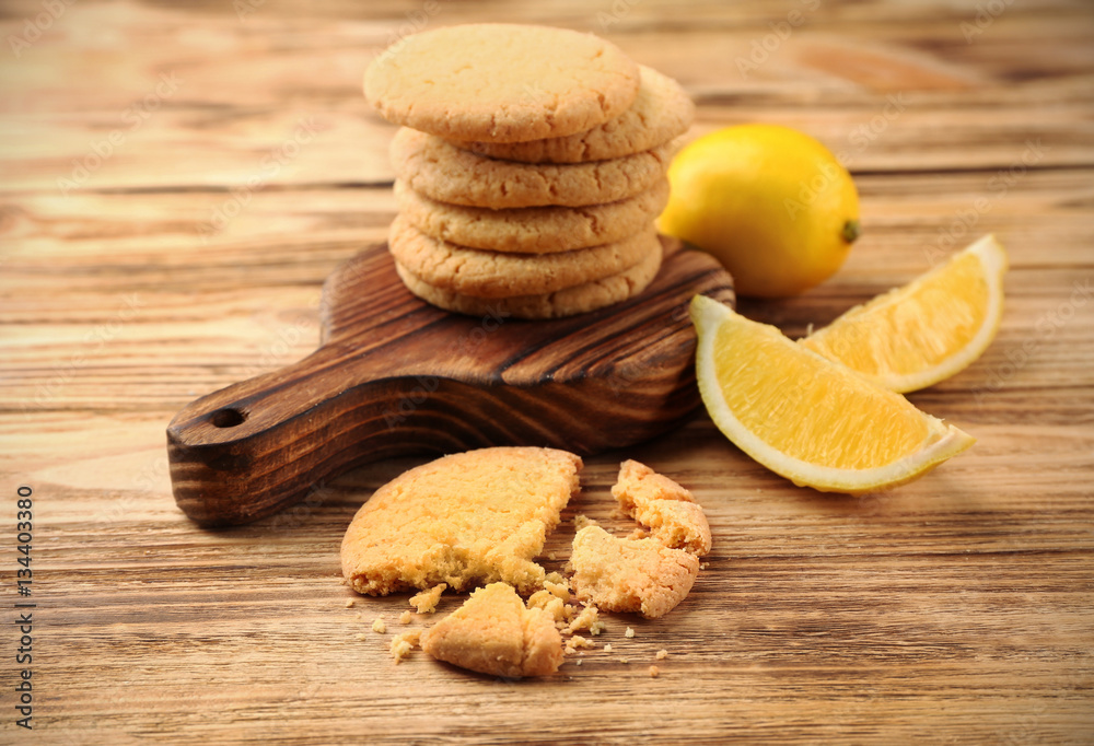 Composition of cookies and lemons on wooden background Composition of cookies and lemons on wooden background