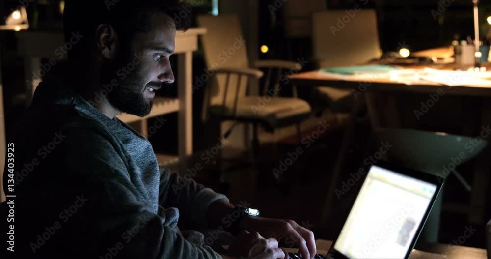 Man working on laptop late night in office 4k Man working on laptop late night in office 4k