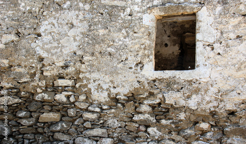 Old wall with a window hole