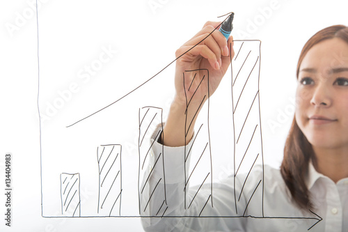 Businesswoman hand write growth graph isolated on white