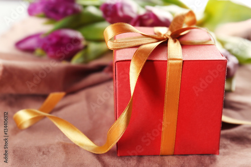 Gift box with tulips, closeup © Africa Studio