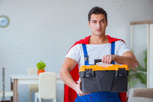 Super hero repairman working at home © Elnur
