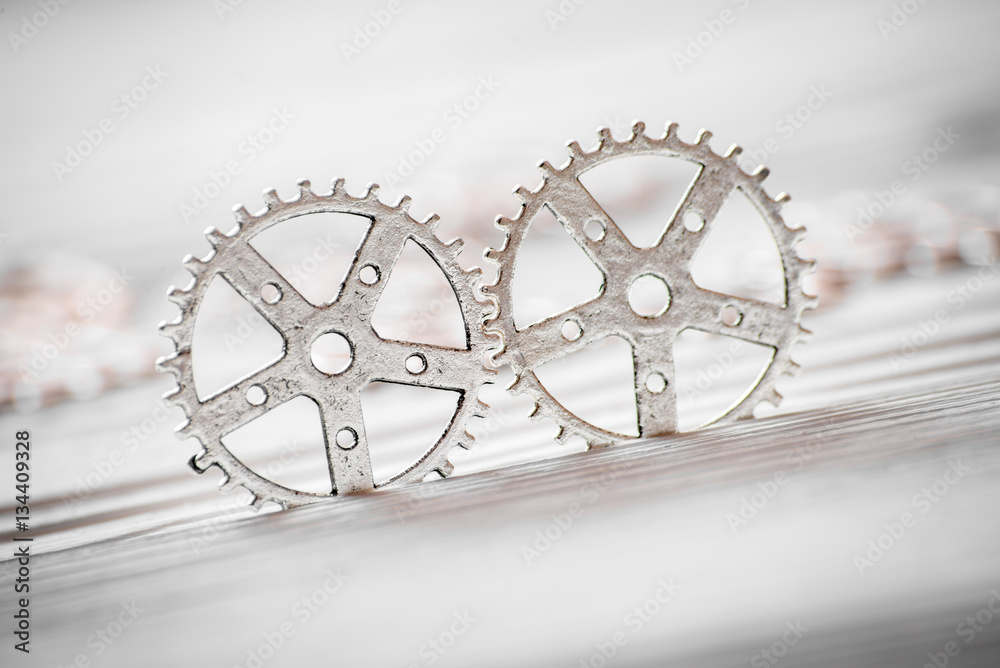 concept hour metal gears on wooden background top view concept hour metal gears on wooden background top view