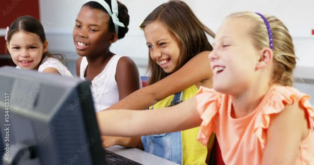 Slow motion of schoolgirls having fun while using computer in classroom at school 4k Slow motion of schoolgirls having fun while using computer in classroom at school 4k