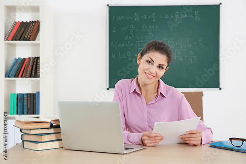 Young beautiful teacher in ...