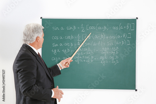 Senior teacher with pointer...