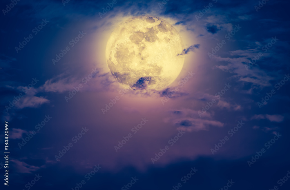 Nighttime sky with clouds and bright full moon. Vintage effect tone Nighttime sky with clouds and bright full moon. Vintage effect tone