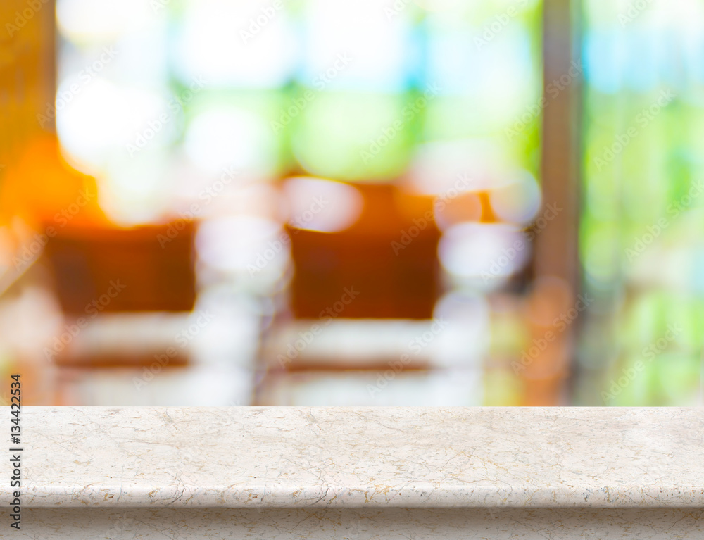 Empty marble table top with blurred cafe bokeh light as backgrou Empty marble table top with blurred cafe bokeh light as backgrou