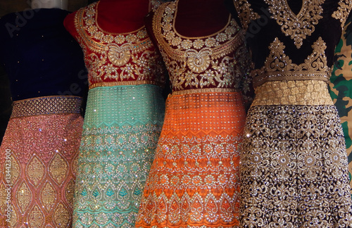 Mannequins dressed in latest traditional Indian fashion kept in front of retail clothes shop 