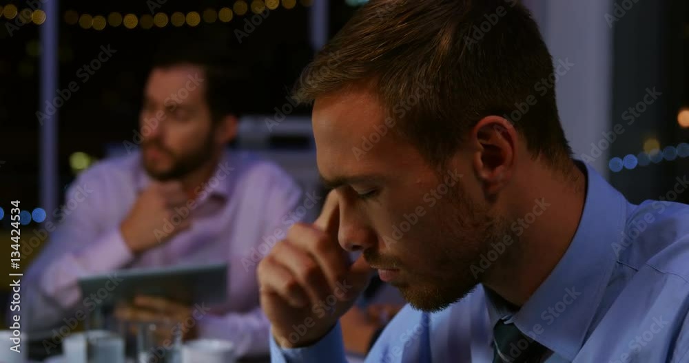 Businessman using digital tablet in office at night 4k Businessman using digital tablet in office at night 4k