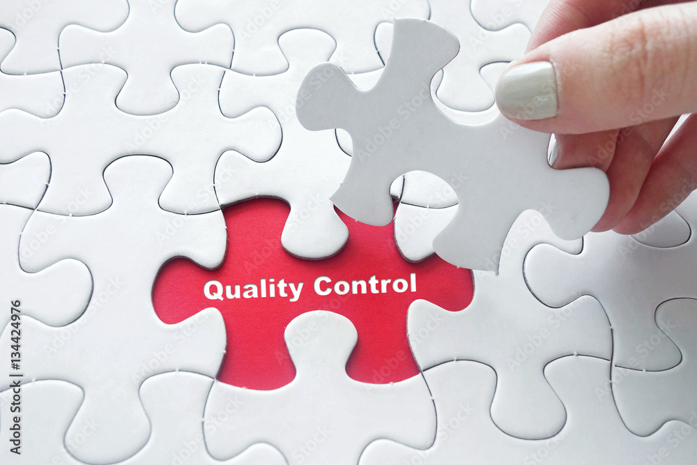 Fototapeta premium Quality Control on jigsaw puzzle