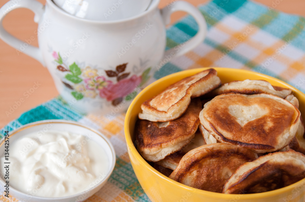 Delicious pancakes with sour cream for breakfast Delicious pancakes with sour cream for breakfast